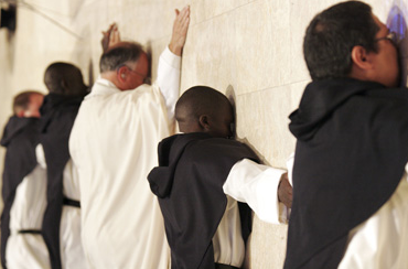 During their profession of vows, the five men prostrate themselves before the altar.